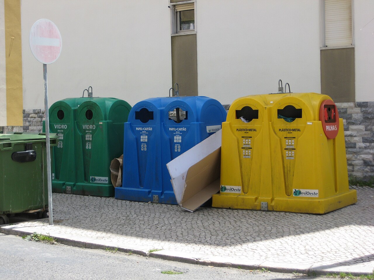 Ecoponto recycling bins in Portugal: blue for paper, yellow for plastic/metal, green for glass